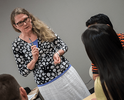 Professor talking to nursing students