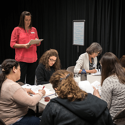 NSC Education professor, Dr. Amanda Carter working with group of students