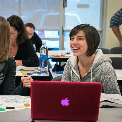 Students laughing during discussion in class