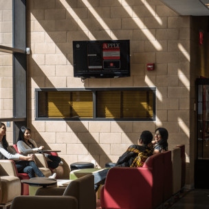 Group of students talking in lounge area