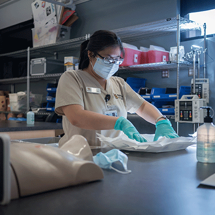 Nursing student laying out materials on table