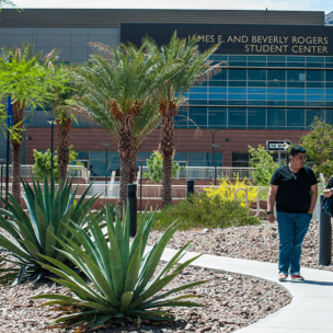 View of two students walking from NSC Rogers Student Center Building