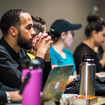 Students sitting in classroom listening to lecture