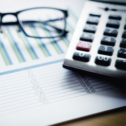 Picture of calculator and glasses sitting on piece of paper