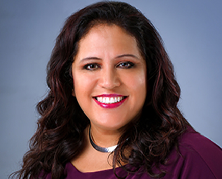 Close up of headshot of Edith Fernandez, Vice President of College and Community Engagement.