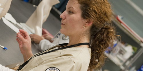 Female Nevada State nursing student in her scrubs.