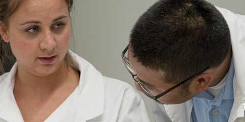 Two students talking in the science lab.