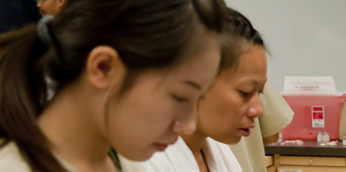 Two female nursing students in the classroom.