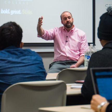 Criminal Justice Professor lecturing to students in classroom