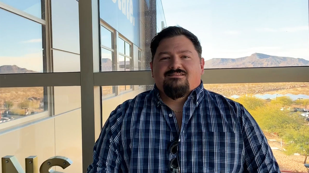 RJ headshot in front of Nevada desert