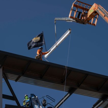 Topping off building with flag