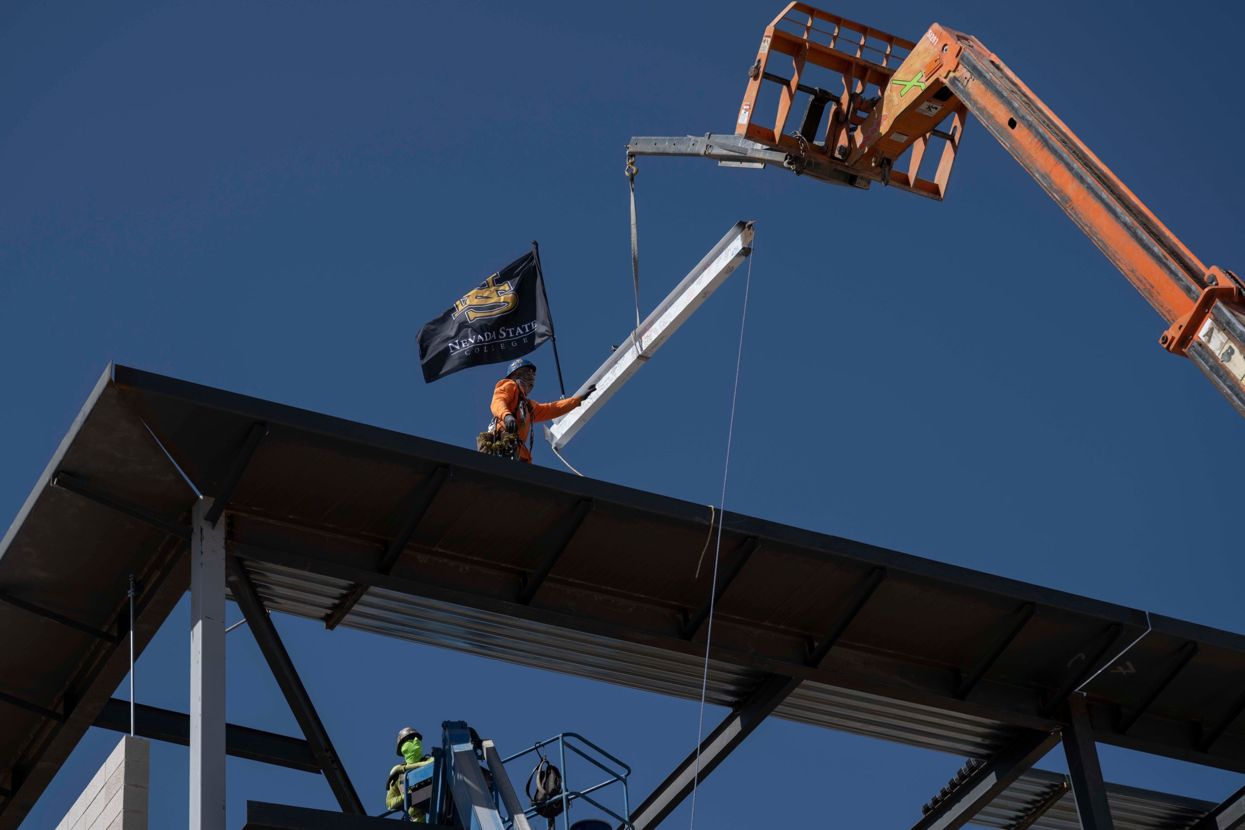 Topping off building with flag