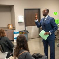 Charles addressing students